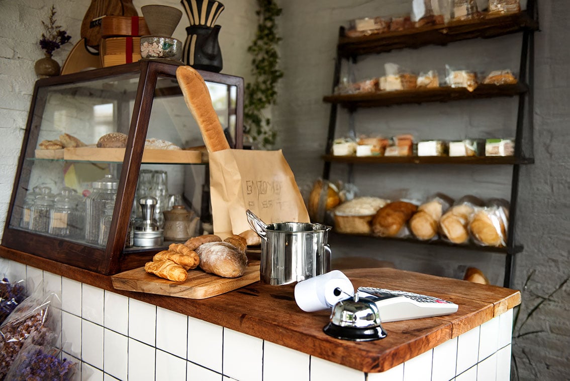 bakery-shop-with-shelves-full-of-baked-goods-long